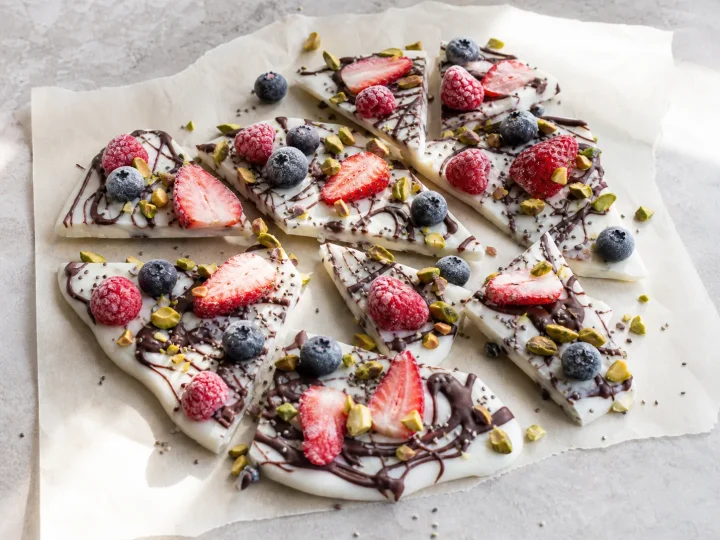 Frozen Greek yogurt bark with dark chocolate, berries, pistachios, and chia seeds